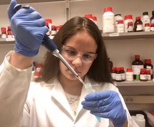 Chemistry student in a lab working on 