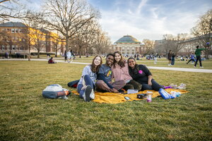 Group of friends at the Main Quad in the Spring Season 