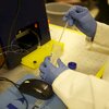 close up photo hands working in chemistry lab