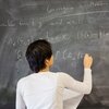 Female professor teaching math to students in Altgeld Hall.