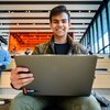 Students study on the monumental study steps area at the Campus Instructional Facility CIF