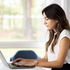 Woman typing on a computer