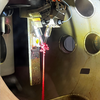 Iron Icicles - In-vacuum solution phase experiments can be complicated. Here the liquid jet that allows the solution to enter the vacuum chamber has a clog that caused the solution to freeze, leading to this pretty rock-like formation of the sample. By: Rachel Wallick, Mirica and Vura-Weis Labs, Department of Chemistry